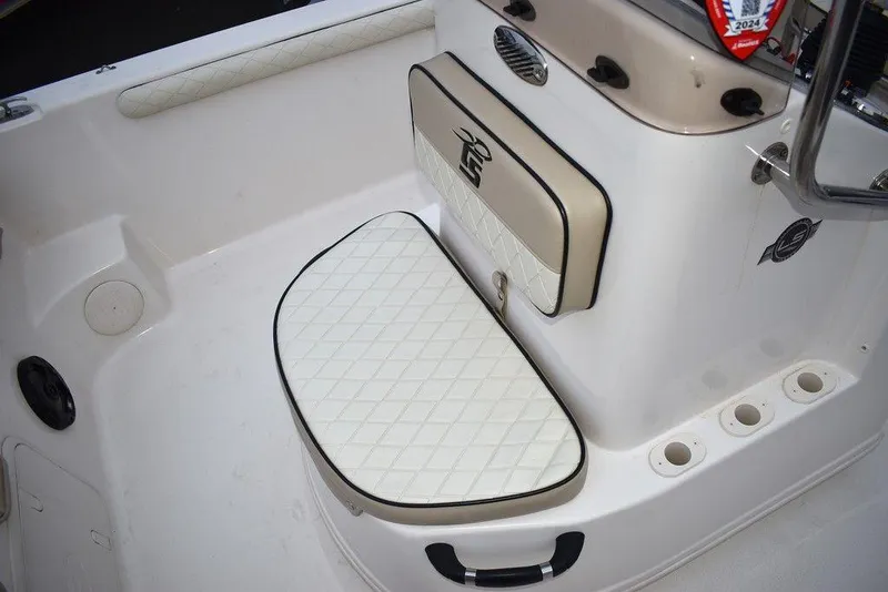 Slide: The Image of 2022 Carolina Skiff 19 LS boat interior with cushioned seating and storage. - 32
