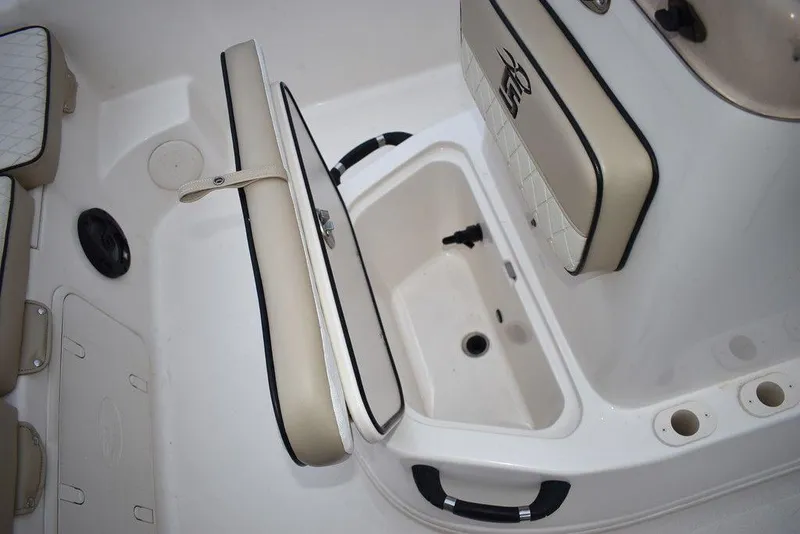 Slide: The Image of 2022 Carolina Skiff 19 LS boat interior with storage compartment open. - 33