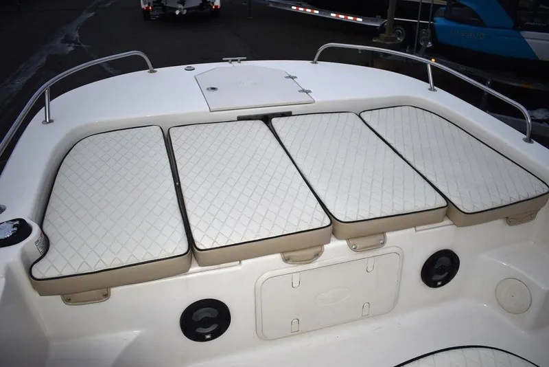 Slide: The Image of 2022 Carolina Skiff 19 LS boat with cushioned seating and storage compartments. - 34