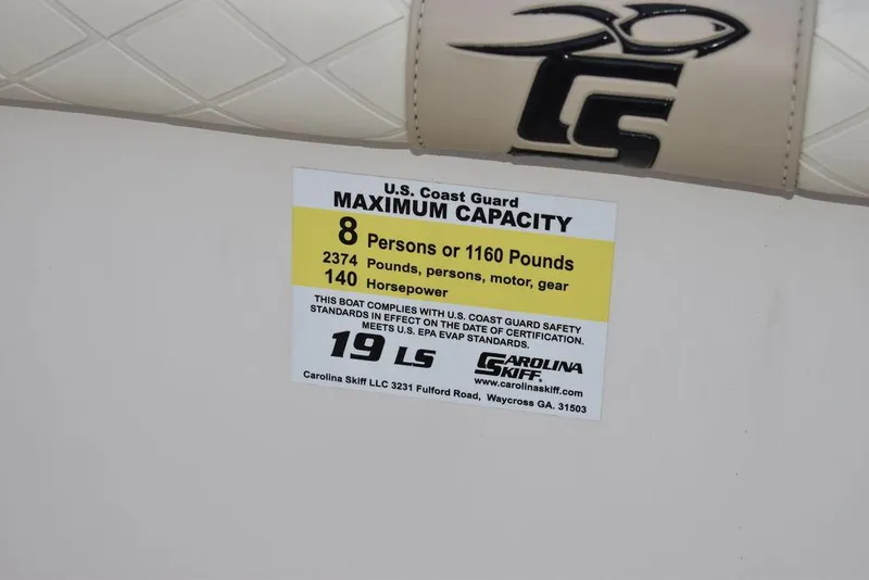 Slide: The Image of Carolina Skiff 19 LS 2022 capacity label: 8 persons, 1160 pounds, 140 horsepower. - 38