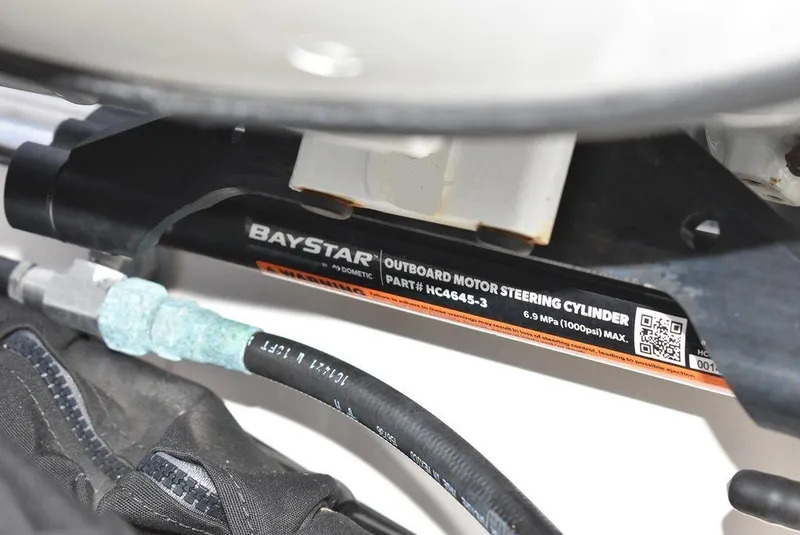 Slide: The Image of BayStar outboard motor steering cylinder on 2022 Carolina Skiff 19 LS boat. - 39