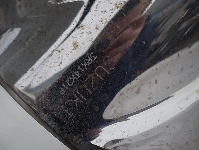 Slide: The Image of Close-up of a Suzuki engine part on a 2022 Carolina Skiff 19 LS boat. - 43