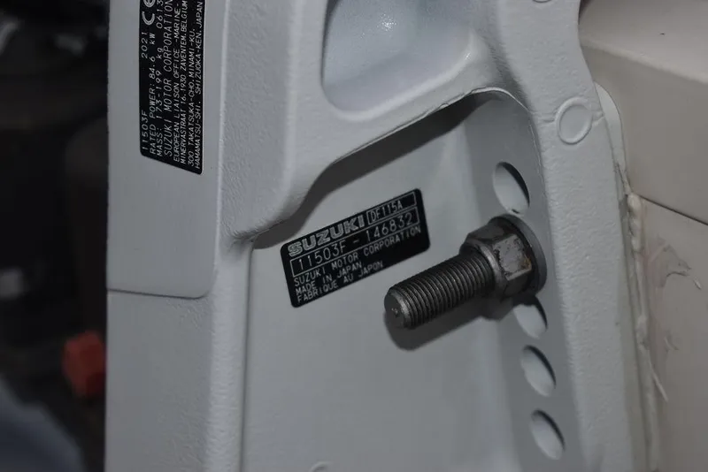 Slide: The Image of Close-up of a Suzuki engine part on a 2022 Carolina Skiff 19 LS boat. - 45