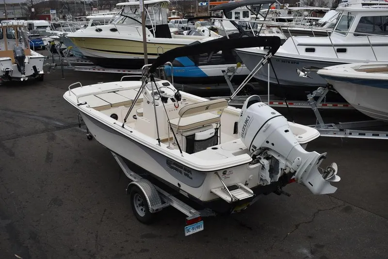 Slide: The Image of 2022 Carolina Skiff 19 LS boat on trailer in marina setting. - 8