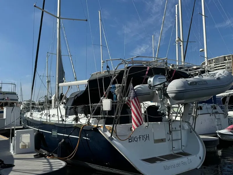 Slide: The Image of 2004 Beneteau Oceanis Clipper 473 sailboat docked at marina, rear view. - 1