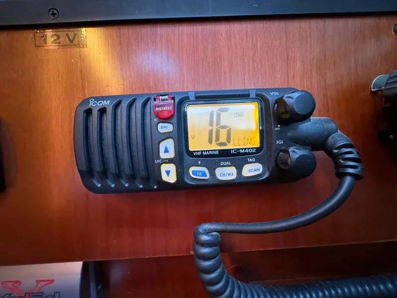 Slide: The Image of VHF marine radio on 2004 Beneteau Oceanis Clipper 473 yacht dashboard. - 26