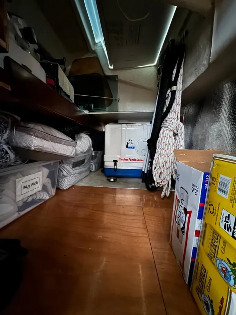 Slide: The Image of Storage area inside 2004 Beneteau Oceanis Clipper 473 yacht, featuring organized supplies and equipment. - 29