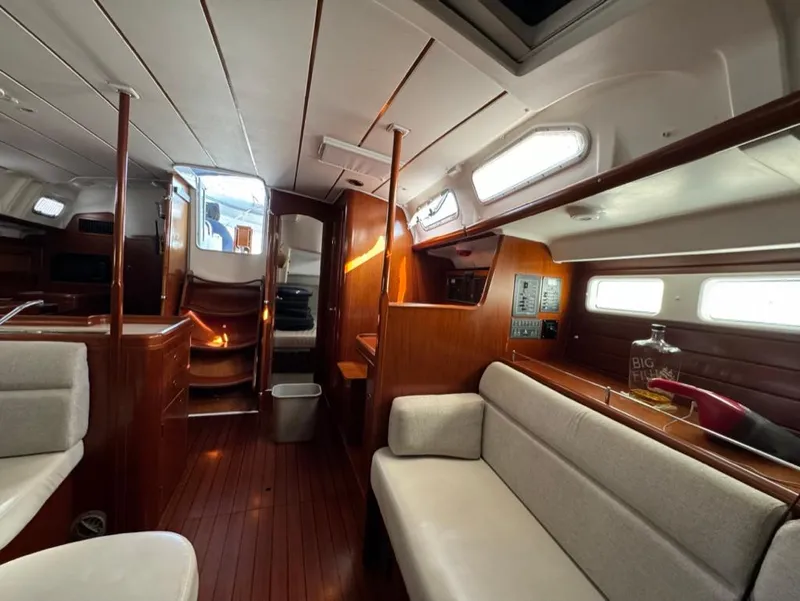 Slide: The Image of Interior of 2004 Beneteau Oceanis Clipper 473 yacht with wooden finish and cozy seating. - 46