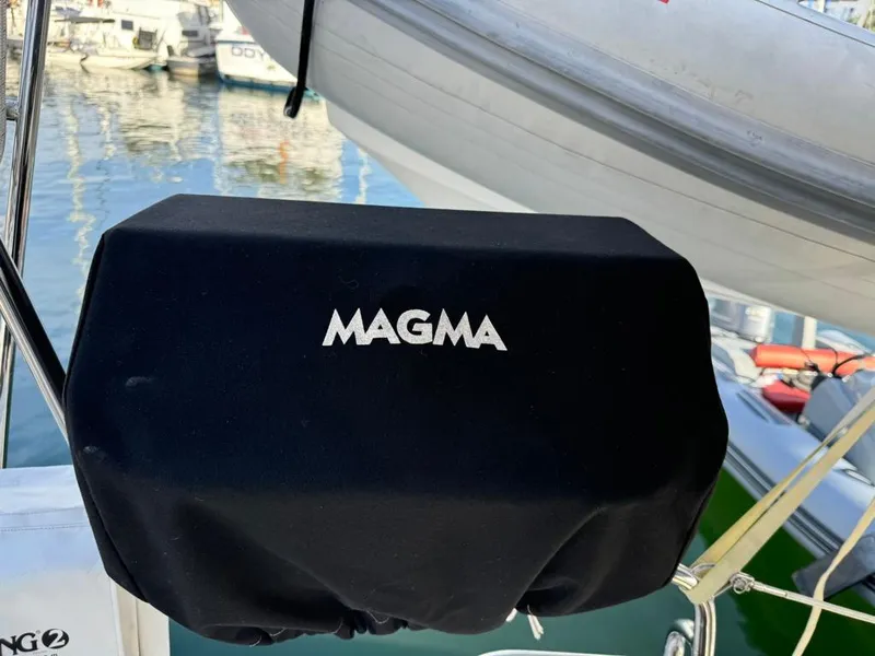 Slide: The Image of Magma grill cover on 2004 Beneteau Oceanis Clipper 473 sailboat at marina. - 49