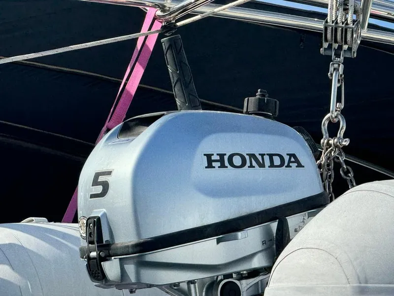 Slide: The Image of Honda 5 outboard motor on a 2004 Beneteau Oceanis Clipper 473 sailboat. - 9