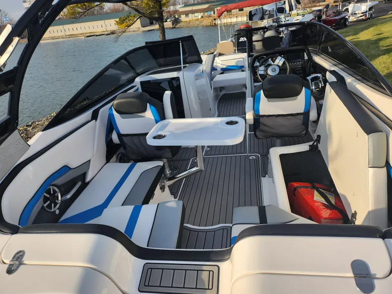 Slide: The Image of 2016 Yamaha Boats 242X E-Series interior, featuring sleek seating and a central table. - 10