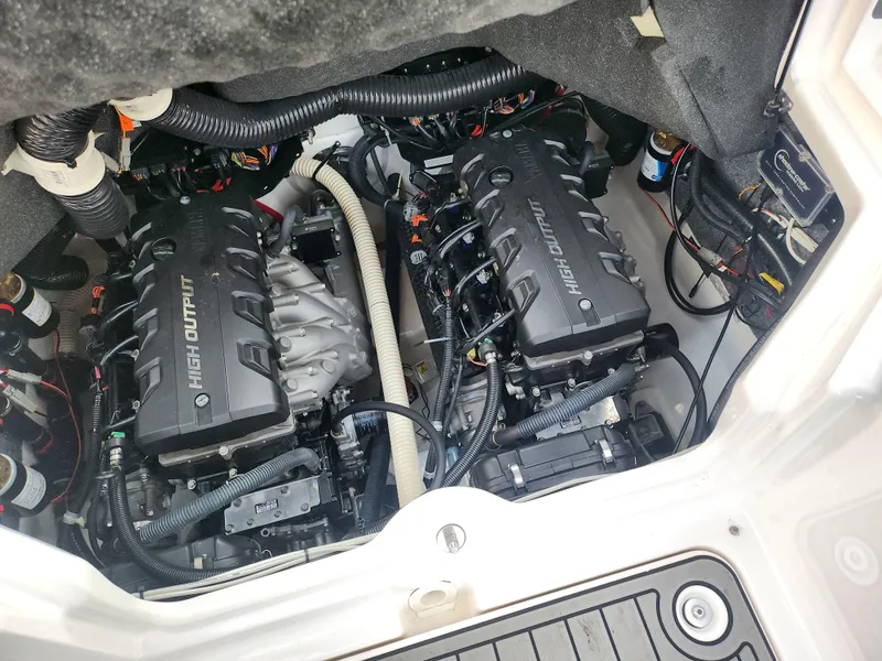 Slide: The Image of 2016 Yamaha Boats 242X E-Series engine compartment with dual high-output engines. - 21