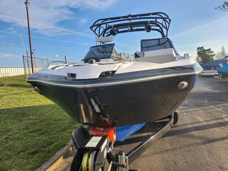 Slide: The Image of 2016 Yamaha Boats 242X E-Series on trailer, sleek design, outdoor setting. - 6