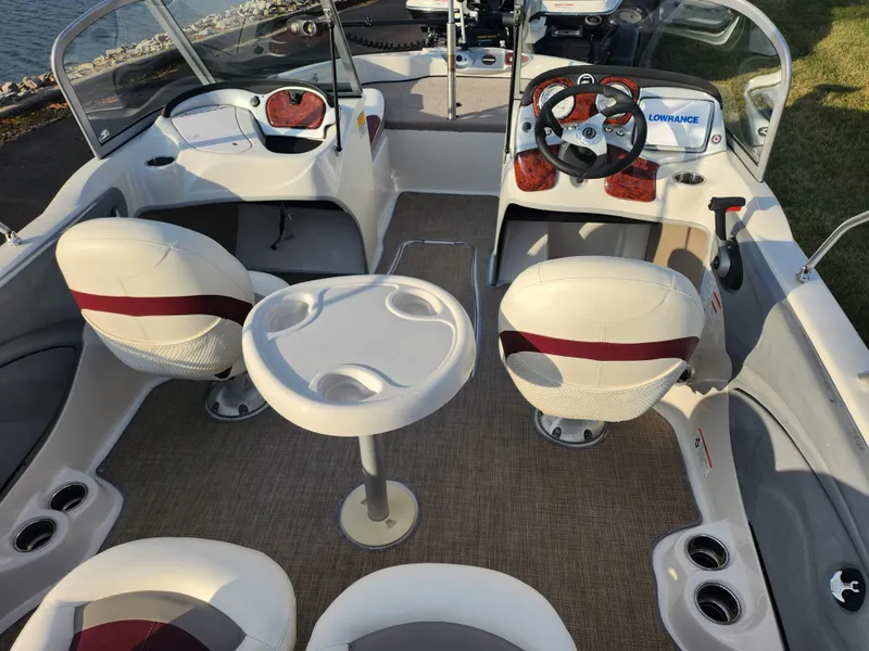 Slide: The Image of Interior of 2013 Nitro 290 Sport boat with seating and steering wheel. - 11