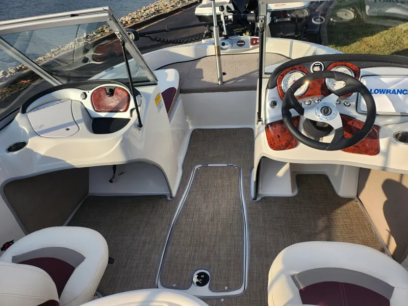 Slide: The Image of 2013 Nitro 290 Sport boat interior with dual steering wheels and modern dashboard. - 12