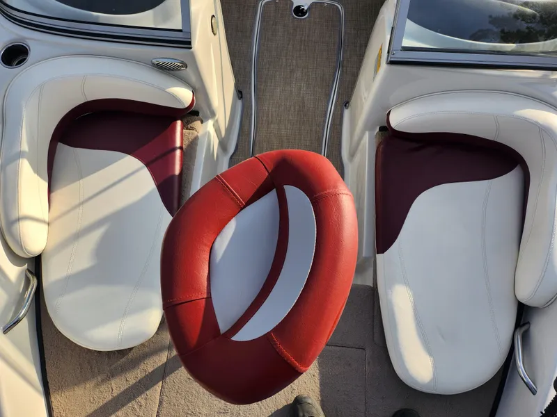 Slide: The Image of Interior of 2013 Nitro 290 Sport boat with red and white seating. - 19