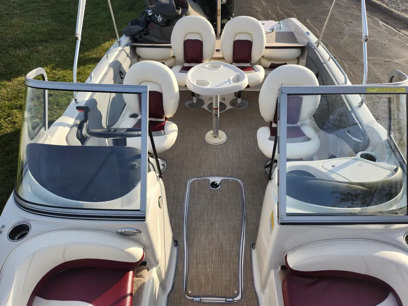 Slide: The Image of 2013 Nitro 290 Sport boat interior with seating and table. - 20