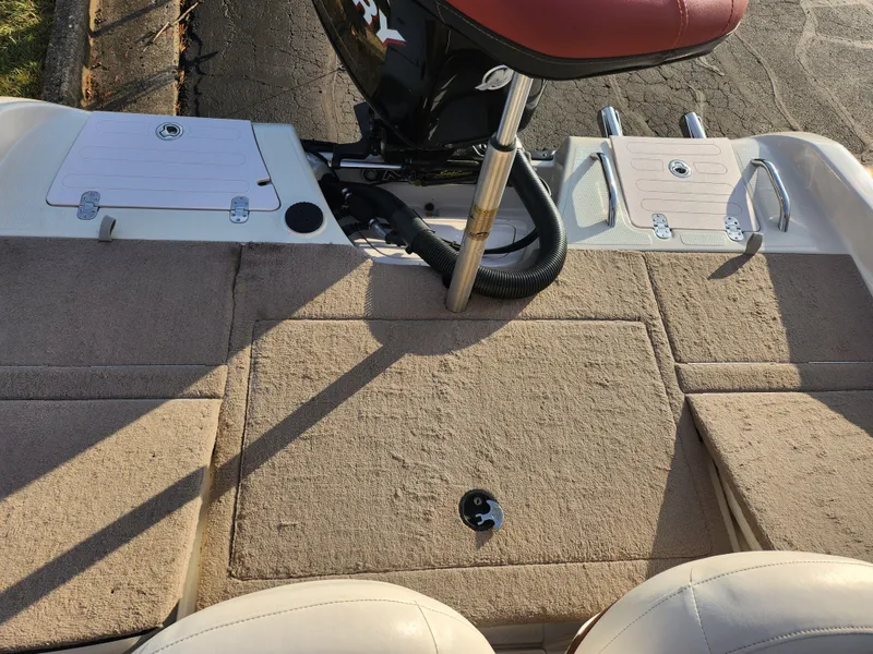 Slide: The Image of 2013 Nitro 290 Sport boat deck with seating and storage compartments. - 21