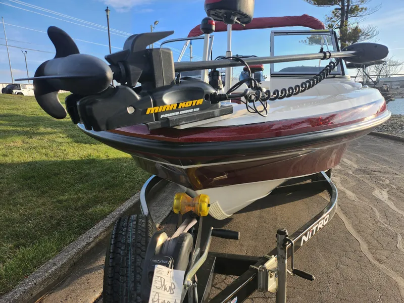 Slide: The Image of 2013 Nitro 290 Sport boat with Minn Kota trolling motor on trailer. - 6