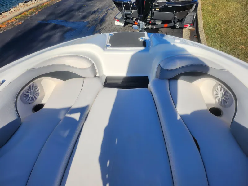 Slide: The Image of 2008 Yamaha Boats 212SS interior with cushioned seating and speakers. - 19