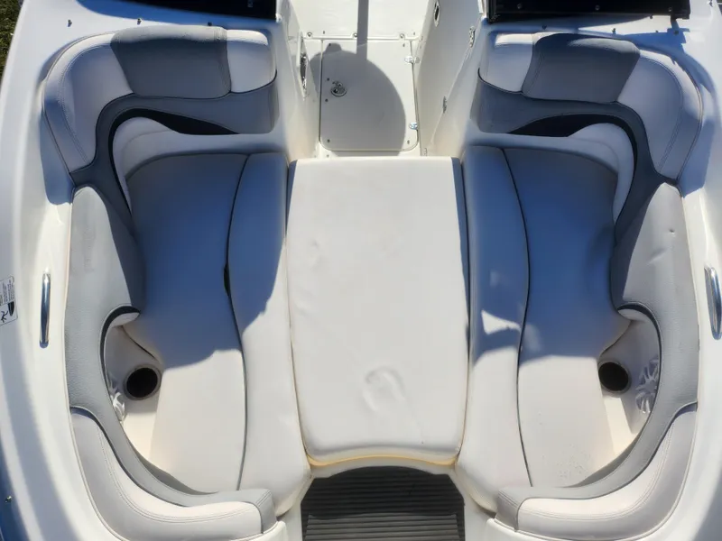 Slide: The Image of 2008 Yamaha Boats 212SS interior seating, white upholstery, spacious layout. - 21