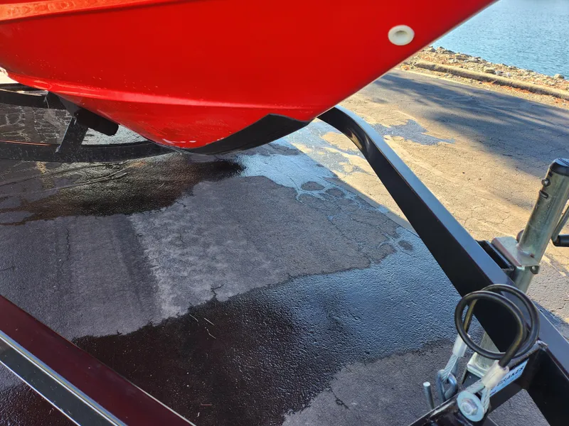 Slide: The Image of Red 2008 Yamaha Boats 212SS on trailer near water. - 9