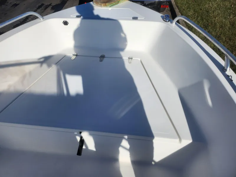 Slide: The Image of 2008 Sea King 180CC boat interior with shadow on white deck. - 13