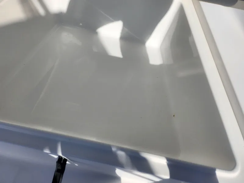 Slide: The Image of Close-up of a 2008 Sea King 180CC boat's interior surface, showing clean, reflective white material. - 14