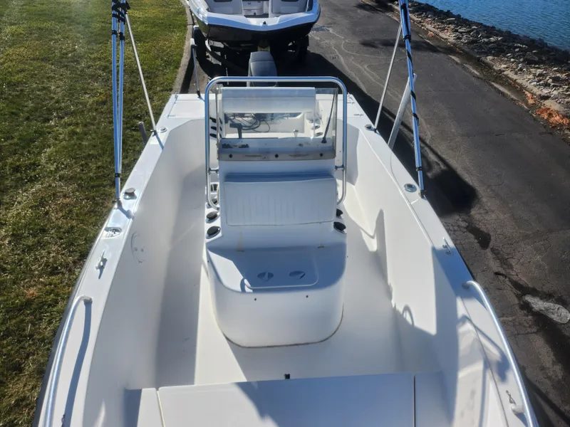 Slide: The Image of 2008 Sea King 180CC boat with center console, docked near water. - 16