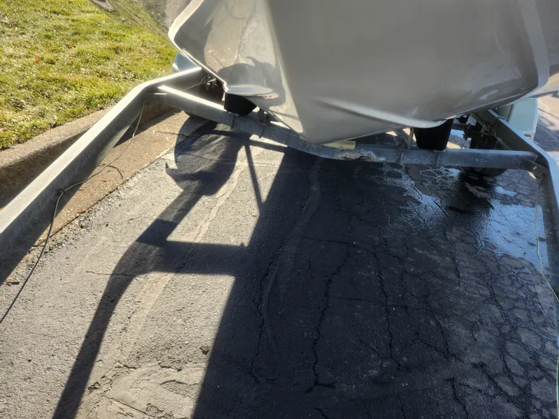 Slide: The Image of 2008 Sea King 180CC boat on trailer, parked on cracked pavement. - 8