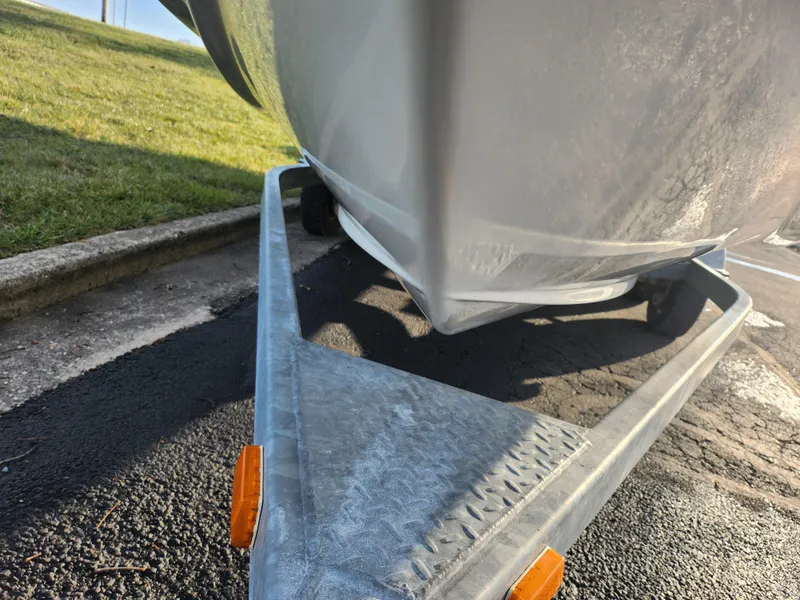 Slide: The Image of 2007 Bayliner 225 boat on trailer, close-up view of hull and trailer frame. - 7