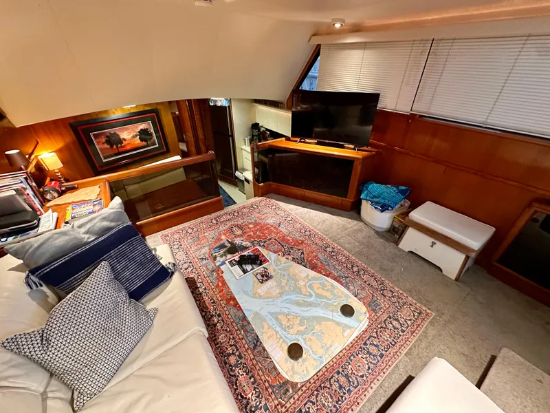 Slide: The Image of Luxurious interior of 1989 Viking 44 Motor Yacht with cozy seating and elegant decor. - 13