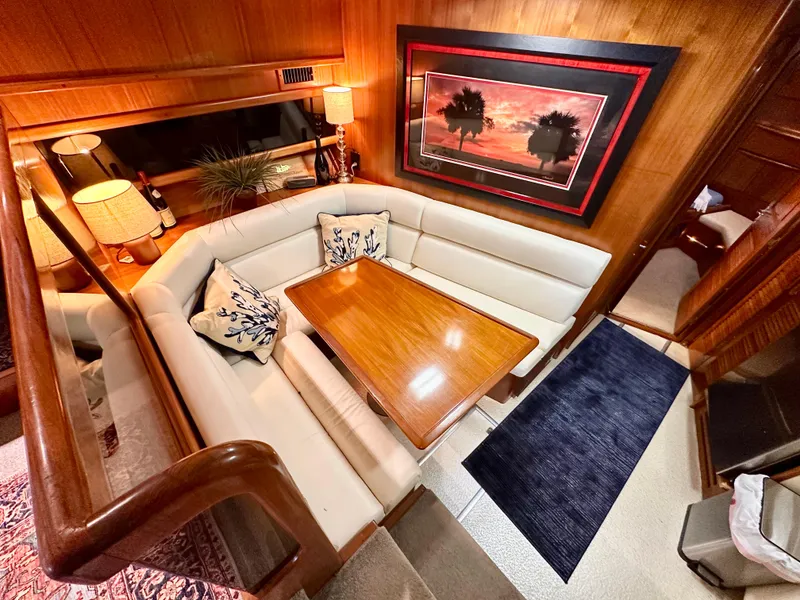 Slide: The Image of Luxurious interior of 1989 Viking 44 Motor Yacht with elegant dining area and artwork. - 16