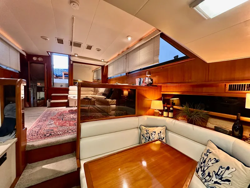 Slide: The Image of Luxurious interior of a 1989 Viking 44 Motor Yacht with elegant wood finishes. - 19