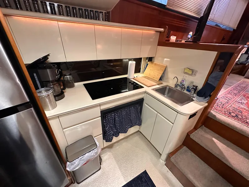 Slide: The Image of 1989 Viking 44 Motor Yacht kitchen with modern appliances and compact design. - 20