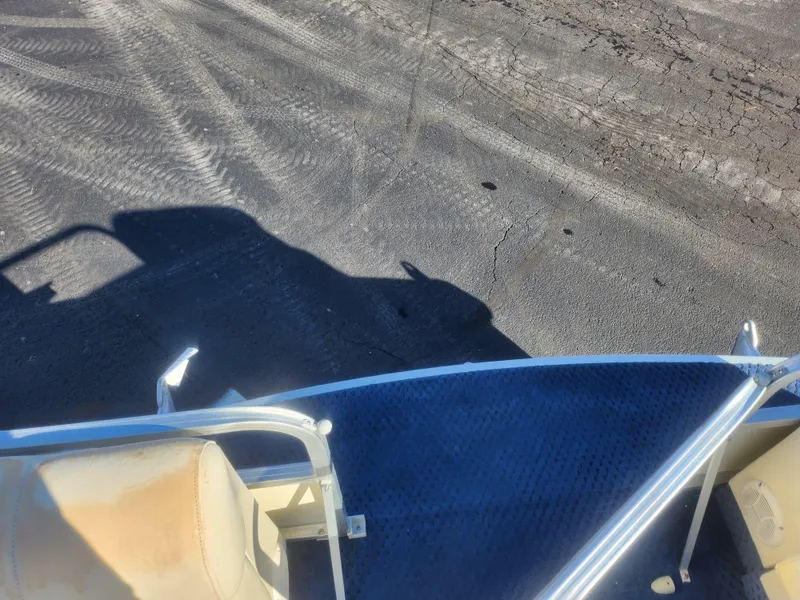 Slide: The Image of 2005 Odyssey 522C boat deck with shadow on asphalt surface. - 22