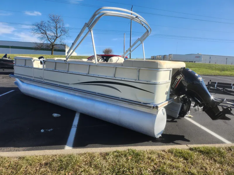 Slide: The Image of 2005 Odyssey 522C pontoon boat with outboard motor in parking lot. - 3