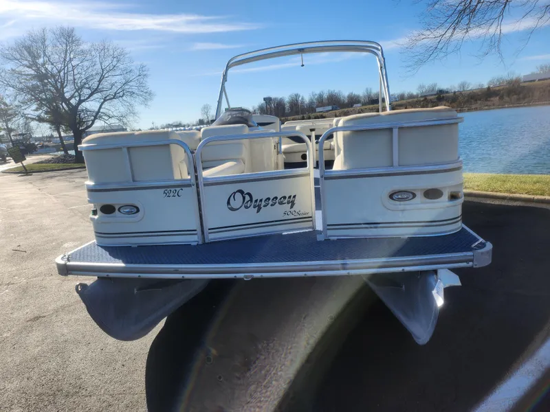 Slide: The Image of 2005 Odyssey 522C pontoon boat parked near a lake on a sunny day. - 6
