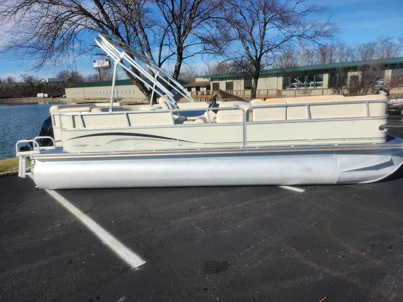 Slide: The Image of 2005 Odyssey 522C pontoon boat parked near a lake on a sunny day. - 9