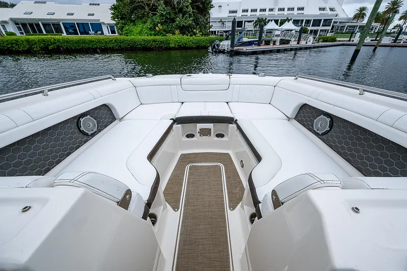 Slide: The Image of 2018 Sea Ray SDX 290 Outboard boat interior with spacious seating and elegant design. - 6