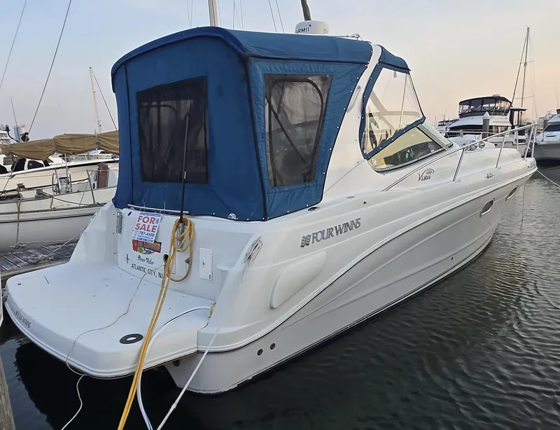 The Image of 2003 Four Winns 328 Vista boat docked, blue canopy, for sale sign visible. - 0