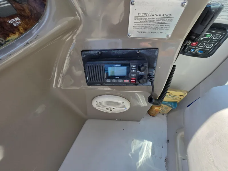 Slide: The Image of 2003 Four Winns 328 Vista yacht dashboard with radio and speaker. - 18
