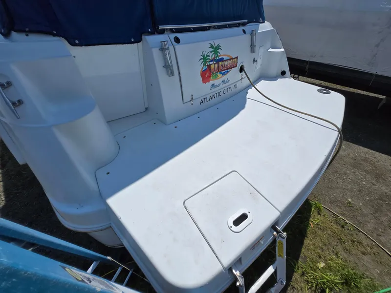 Slide: The Image of 2003 Four Winns 328 Vista boat stern with swim platform, docked in Atlantic City. - 23