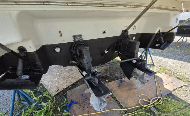 Slide: The Image of 2003 Four Winns 328 Vista boat stern with dual outdrives on stands. - 36