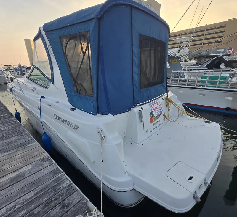 Slide: The Image of 2003 Four Winns 328 Vista boat with blue canopy, docked and for sale. - 4