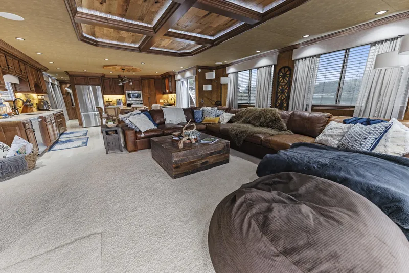 Slide: The Image of Luxurious houseboat interior with cozy seating, wooden accents, and modern kitchen. Sharpe 20 x 100, 2009. - 10