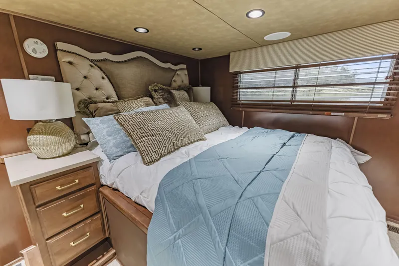 Slide: The Image of Luxurious bedroom interior in 2009 Sharpe 20 x 100 houseboat with plush bedding and elegant decor. - 16