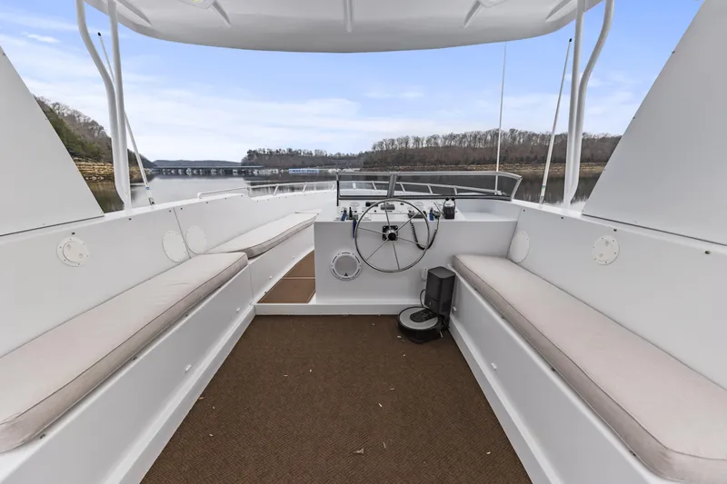 Slide: The Image of Interior view of a 2009 Sharpe 20 x 100 boat with seating and steering wheel. - 31