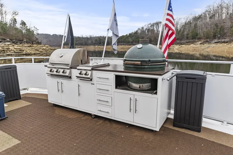 Slide: The Image of Outdoor kitchen on a Sharpe 20 x 100 houseboat, featuring grills and storage, 2009 model. - 35