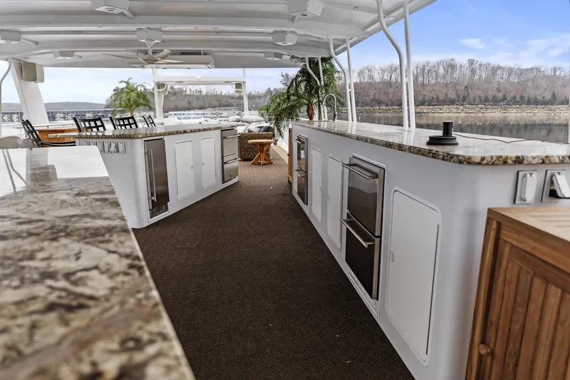 Slide: The Image of Luxurious outdoor kitchen on a 2009 Sharpe 20 x 100 houseboat with scenic river view. - 36